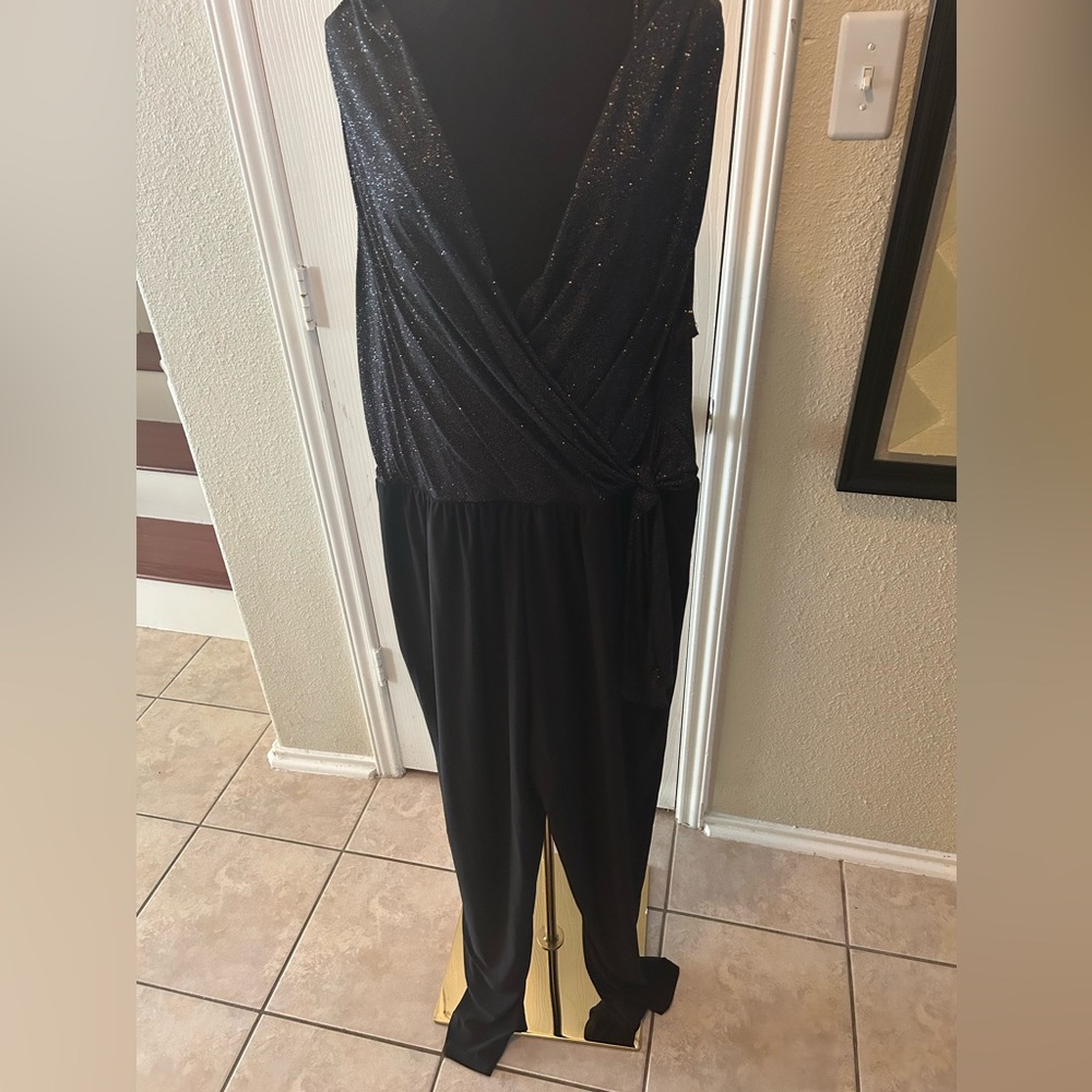 Black sparkle top and black pant jumpsuit. V-Neck and a side tie